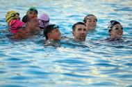 Michael Phelps and three-time Olympian Allison Schmitt participate in a charity swim (Photo by Christian Petersen/Getty Images)